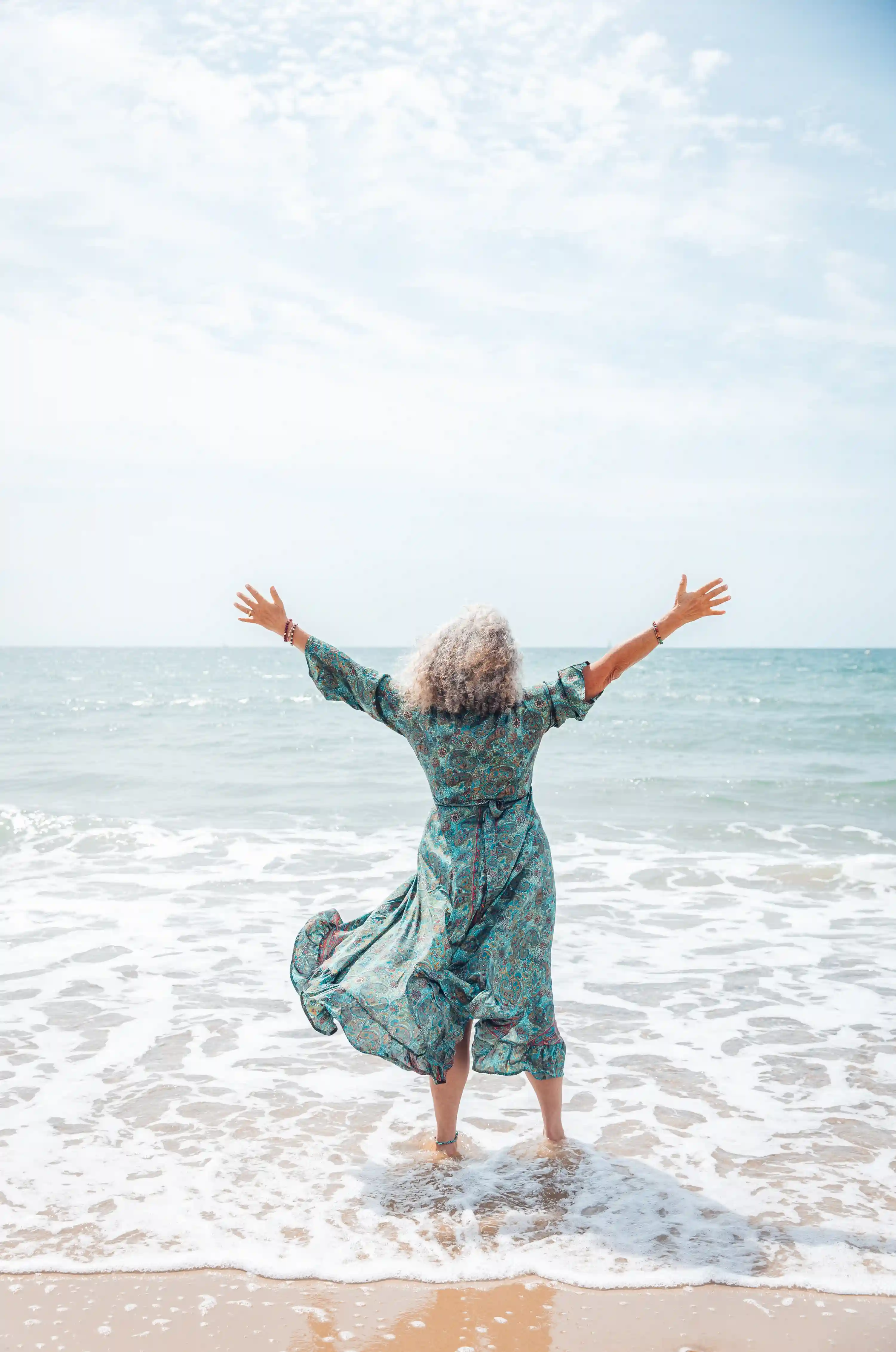 Jyoti on the beach, feeling the freedom.