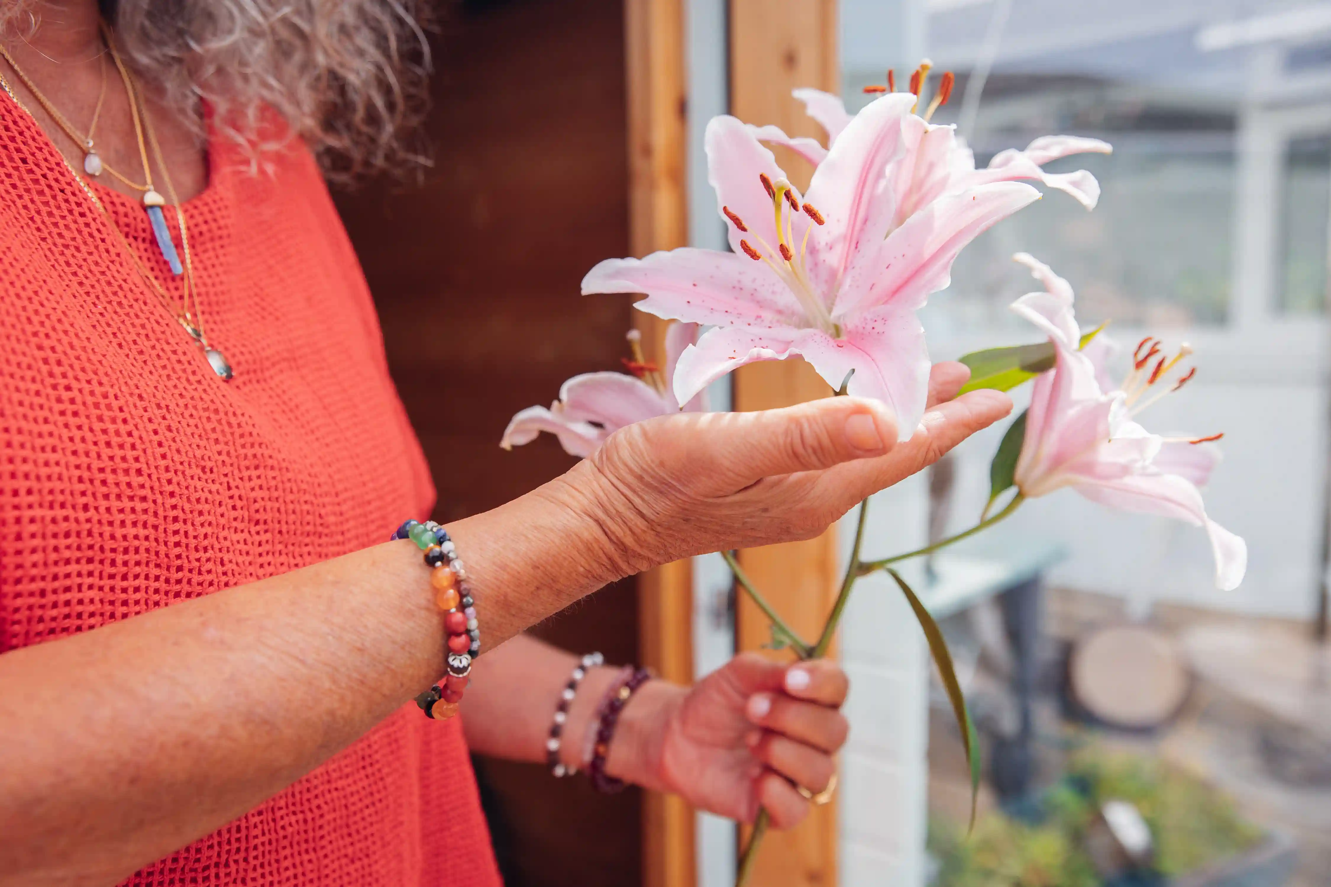 Jyoti holding a flower.